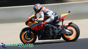 2007 Red Bull U.S. Grand Prix - Dani Pedrosa: Dani Pedrosa between the Corkscrew and turn 9. Taken at 125th shutter speed so the spokes are invisable.
